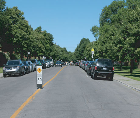 Traffic calming measure with flexible bollard - City of Montreal