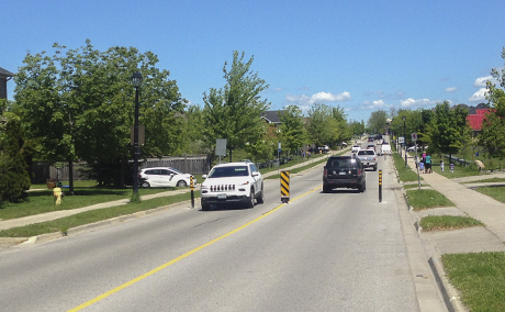 Traffic calming example with signs and bollards - Collector road - Town of Newmarket