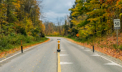 Traffic calming with flexible signs / flexible delineators on a rural road in Peel Region Ontario