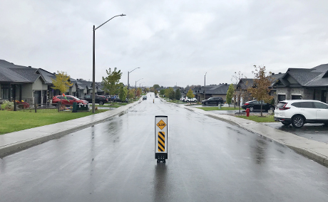 Traffic calming with slow flexible centre signs local residential street